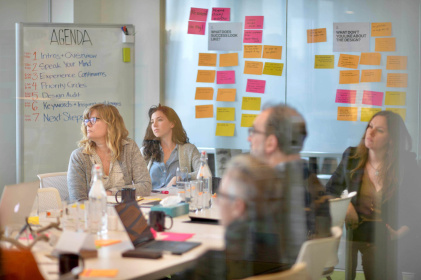 Several UX consultants from Blink discuss challenges and opportunities at a kickoff meeting